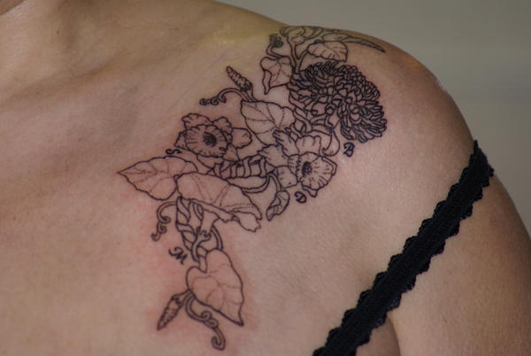 flower tattoos on spine. hairstyles flower tattoos on