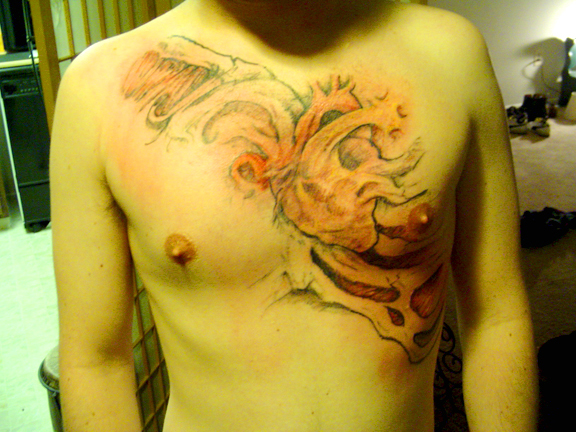heart chest tattoo by
