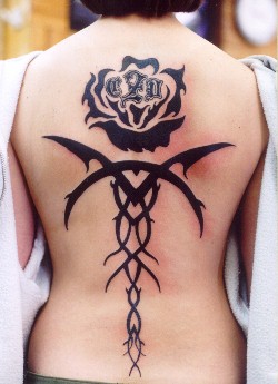 black rose tattoo on back