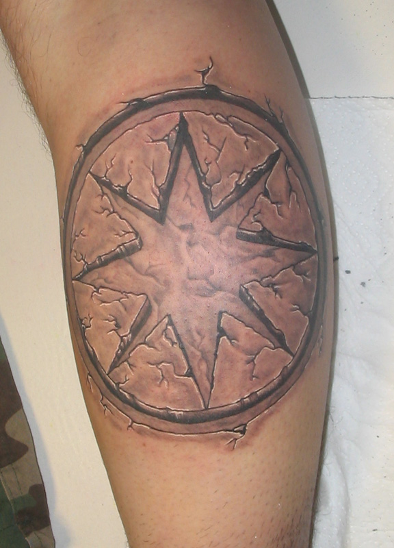 star tattoo on elbow. star tattoo