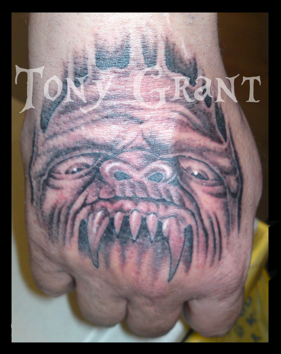 Demon hand tattoo by