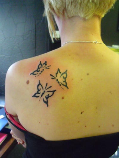 Butterfly tribal tattoo by