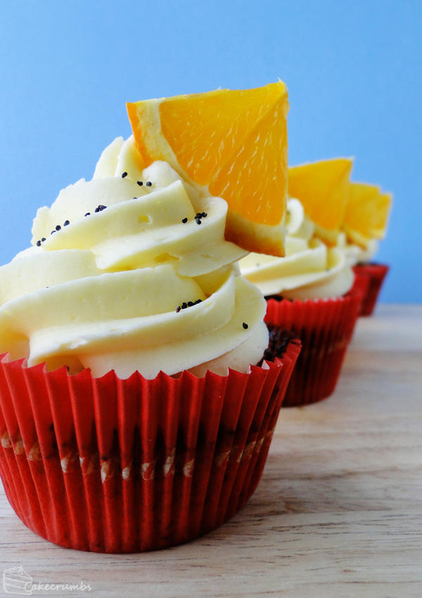 orange_and_poppy_seed_cupcakes_by_cakecrumbs-d5kvinh.jpg