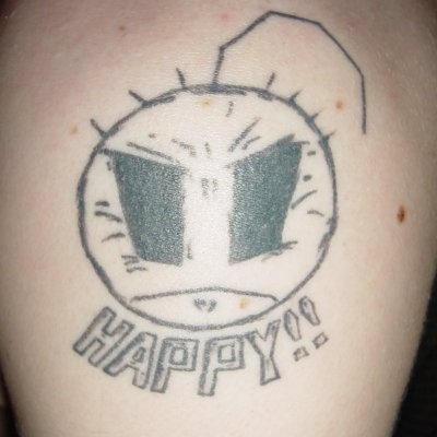 Happy - shoulder tattoo
